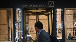 A man is seen outside the US headquarters of Deutsche Bank on July 8, 2019 in New York City. - From Asia to the United States, disconsolate staff at Deutsche Bank dealt Monday with news of massive layoffs with some already heading to the exits to drown their sorrows.The German giant's share price fell to a low of 6.66 euros ($7.47) before closing down 5.4 percent at 6.79 euros, following Sunday's announcement of 18,000 job losses by 2022 as the company transitions out of high-risk investment banking. (Photo by Angela Weiss / AFP)        (Photo credit should read ANGELA WEISS/AFP via Getty Images)