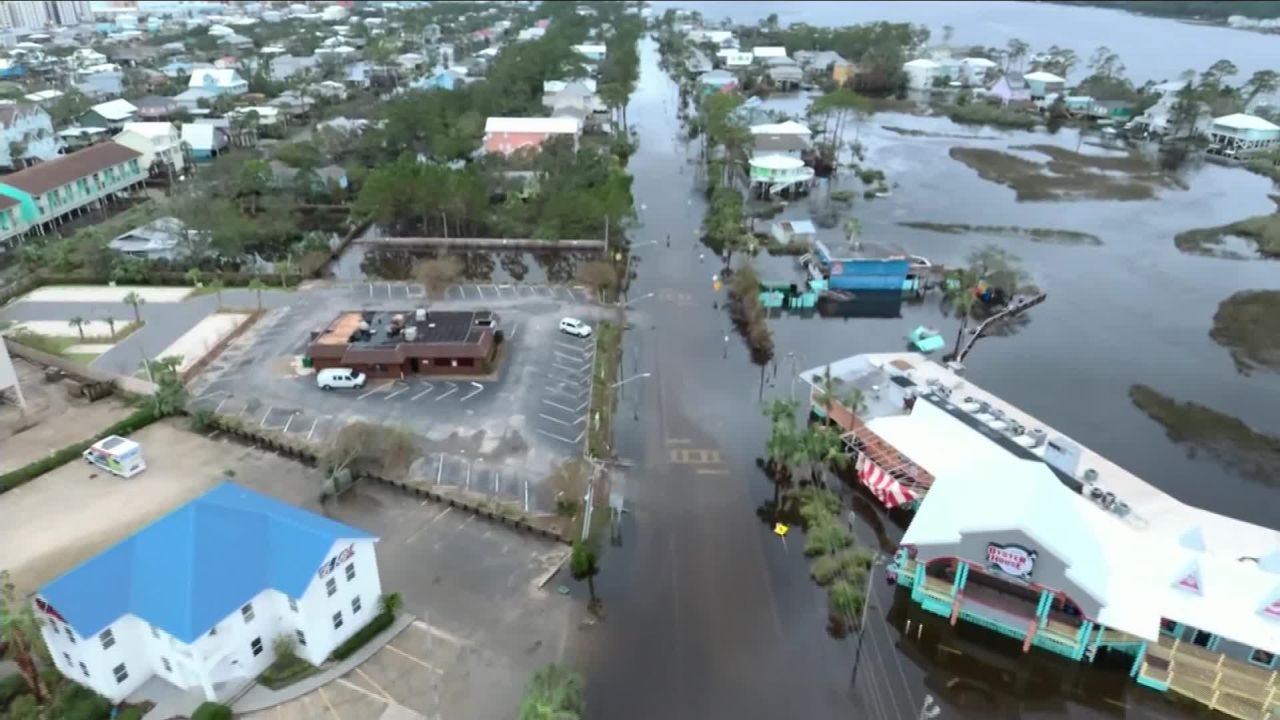 Water submerges a road along a commercial strip Thursday in Gulf Shores, Alabama, a day after Hurricane Sally struck.