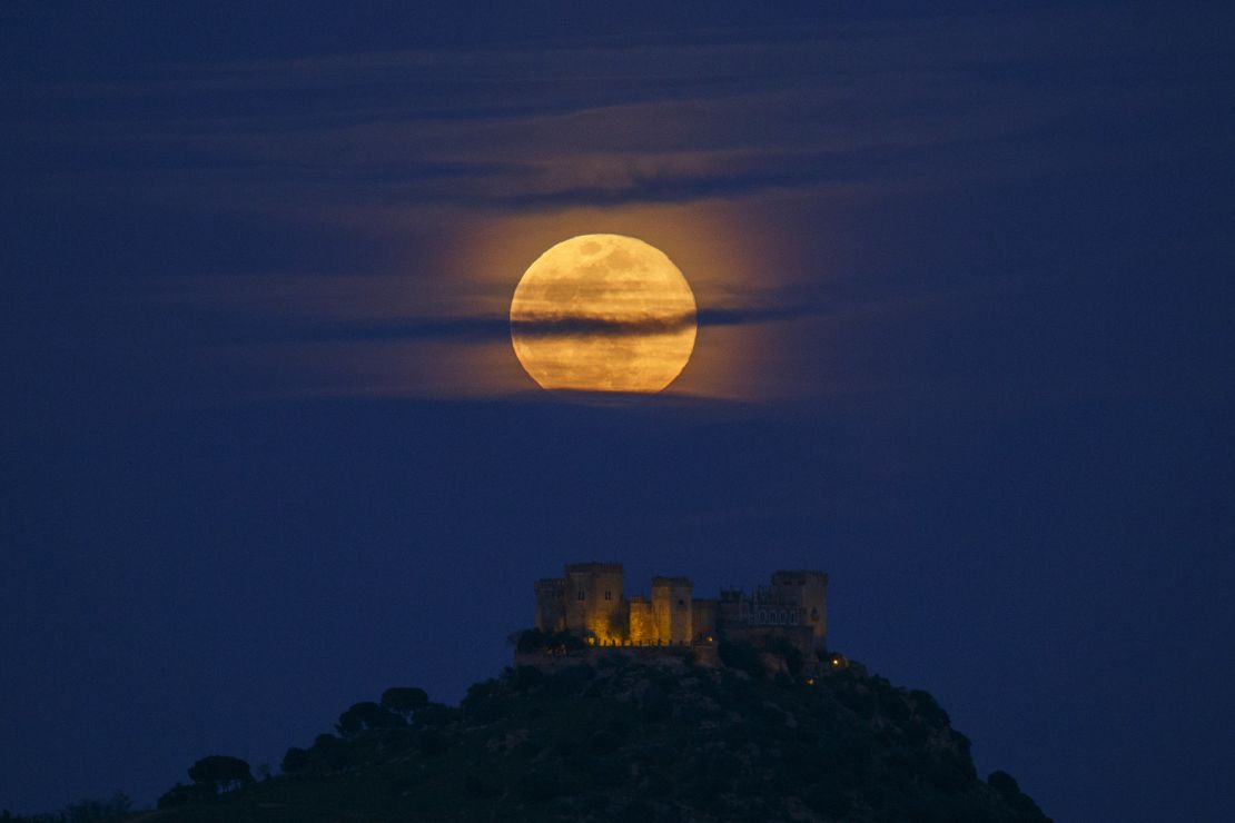 A full (blue) moon rises over Almodovar del Rio Castle on March 31, 2018, in Spain.