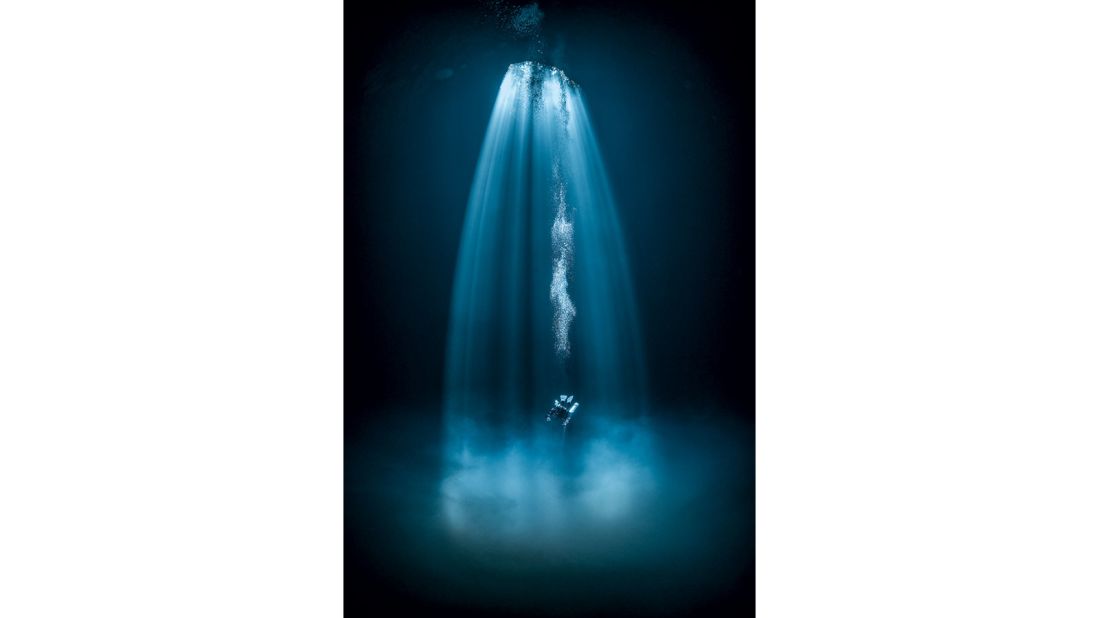 <strong>Wide-Angle: </strong>"On the surface at the cenote's entrance, I had no idea what sort of space lay beneath the small pool. Only when I descended and positioned myself outside the area lit up by sun was the dark space revealed," says winner Martin Strmiska. 