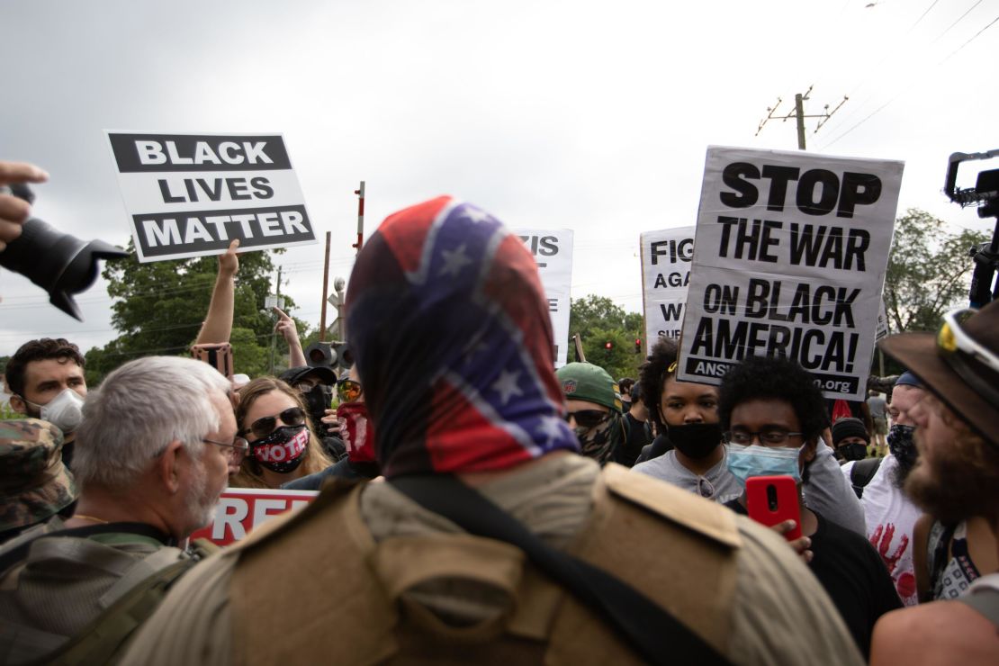 Anti-racist and anti-facist protesters led by F.L.O.W.E.R, an organization based in Atlanta to combat racism, face off against far-right militias and White-pride organizations near Stone Mountain Park in Georgia on August 15, 2020. 