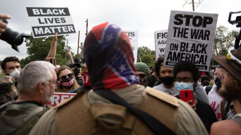 Anti-racist and anti-facist protesters led by F.L.O.W.E.R, an organization based in Atlanta to combat racism, face off against far-right militias and White-pride organizations near Stone Mountain Park in Georgia on August 15, 2020.