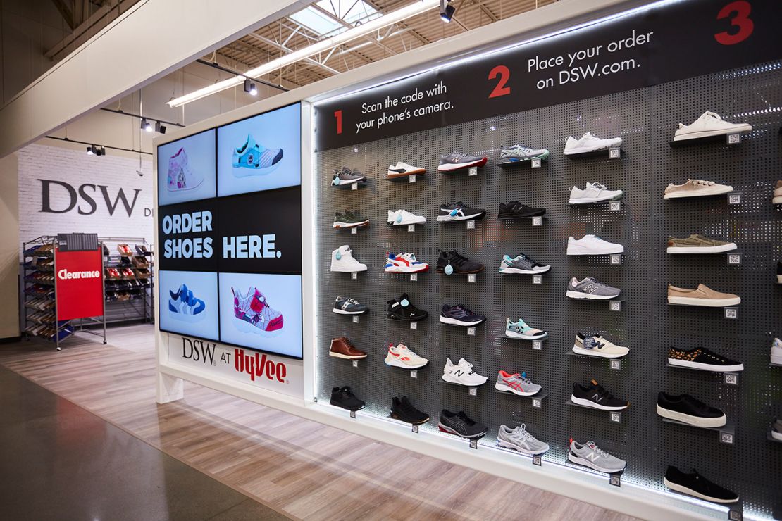 DSW is rolling out mini shoe shops inside of Hy-Vee grocery stores.