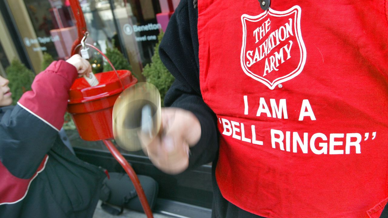 A Salvation Army bell ringer in action outside a Chcago store in 2003. 