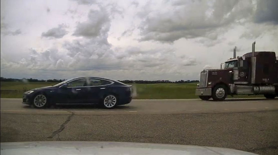 Canadian police have charged a 20-year-old man with dangerous driving after he was found apparently asleep at the wheel of a Tesla.