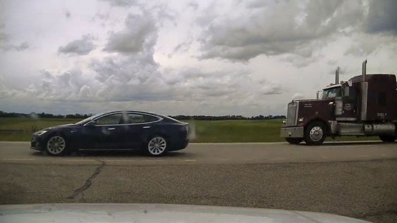 Canadian police have charged a 20-year-old man with dangerous driving after he was found apparently asleep at the wheel of a Tesla.