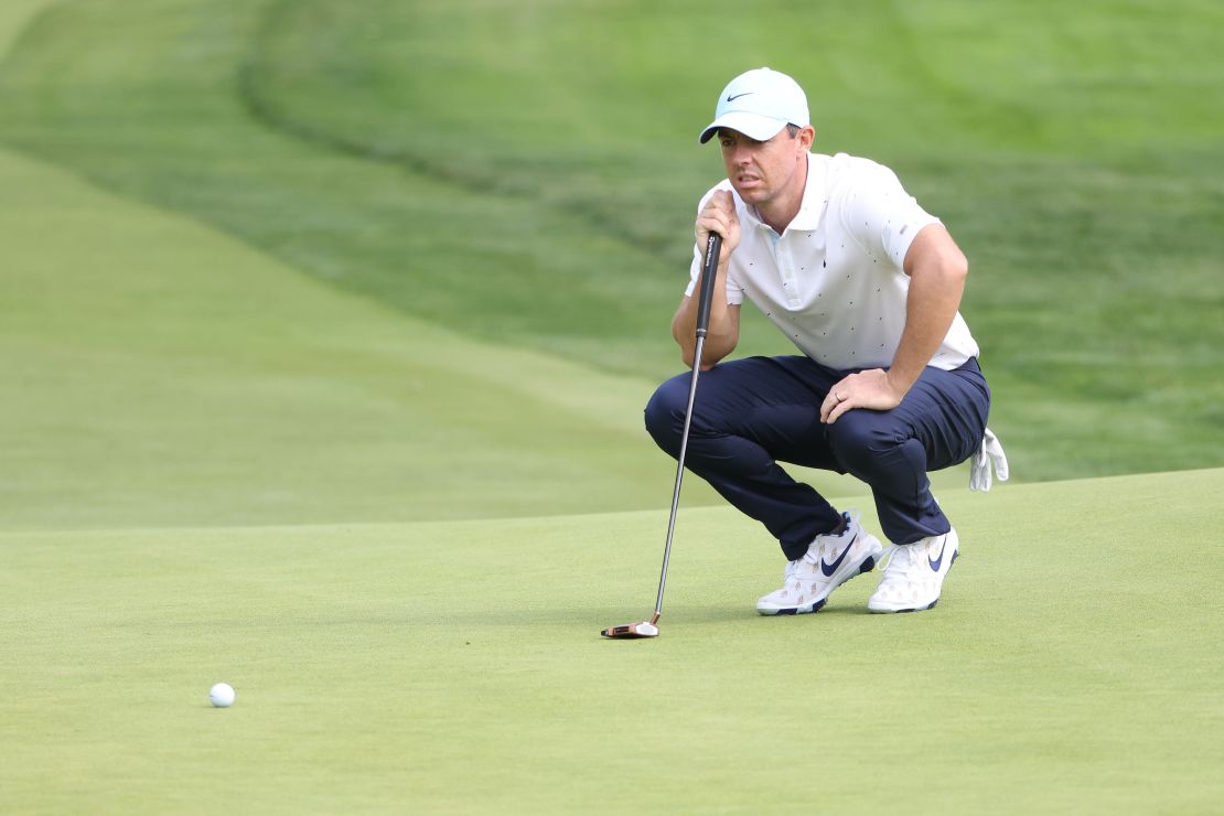 McIlroy lines up a putt on the 17th green.