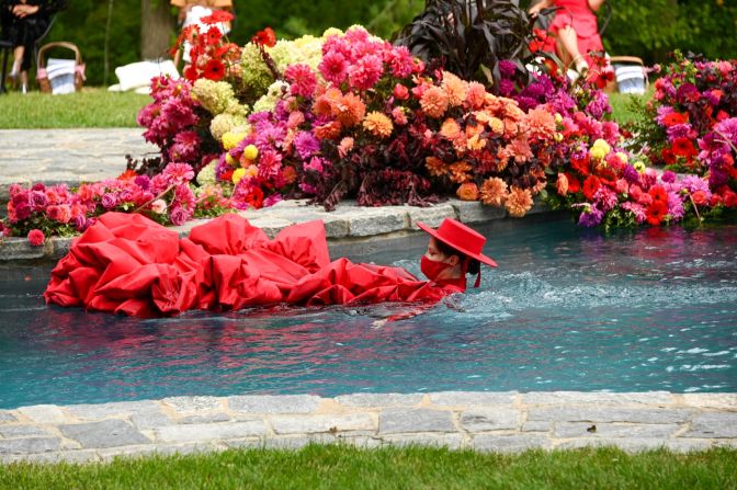 Model Coco Rocha swims through the water at a private location during the Christian Siriano show in Connecticut. 