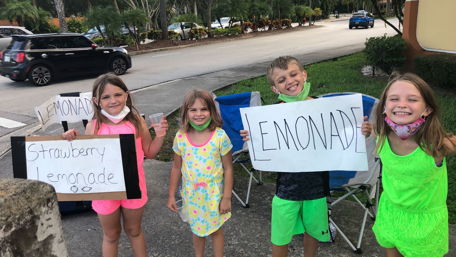 Bailey's four children helping her sell lemonade.