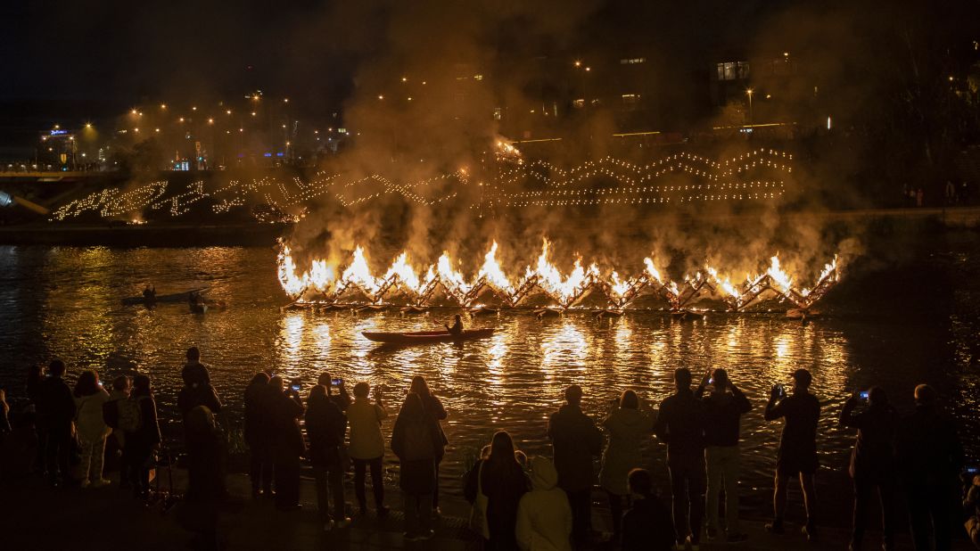 <strong>Vilnius, Lithuania:</strong> People watch the autumn equinox celebration on the embankment of the Neris River near King Mindaugas' Bridge on September 20, 2019. 