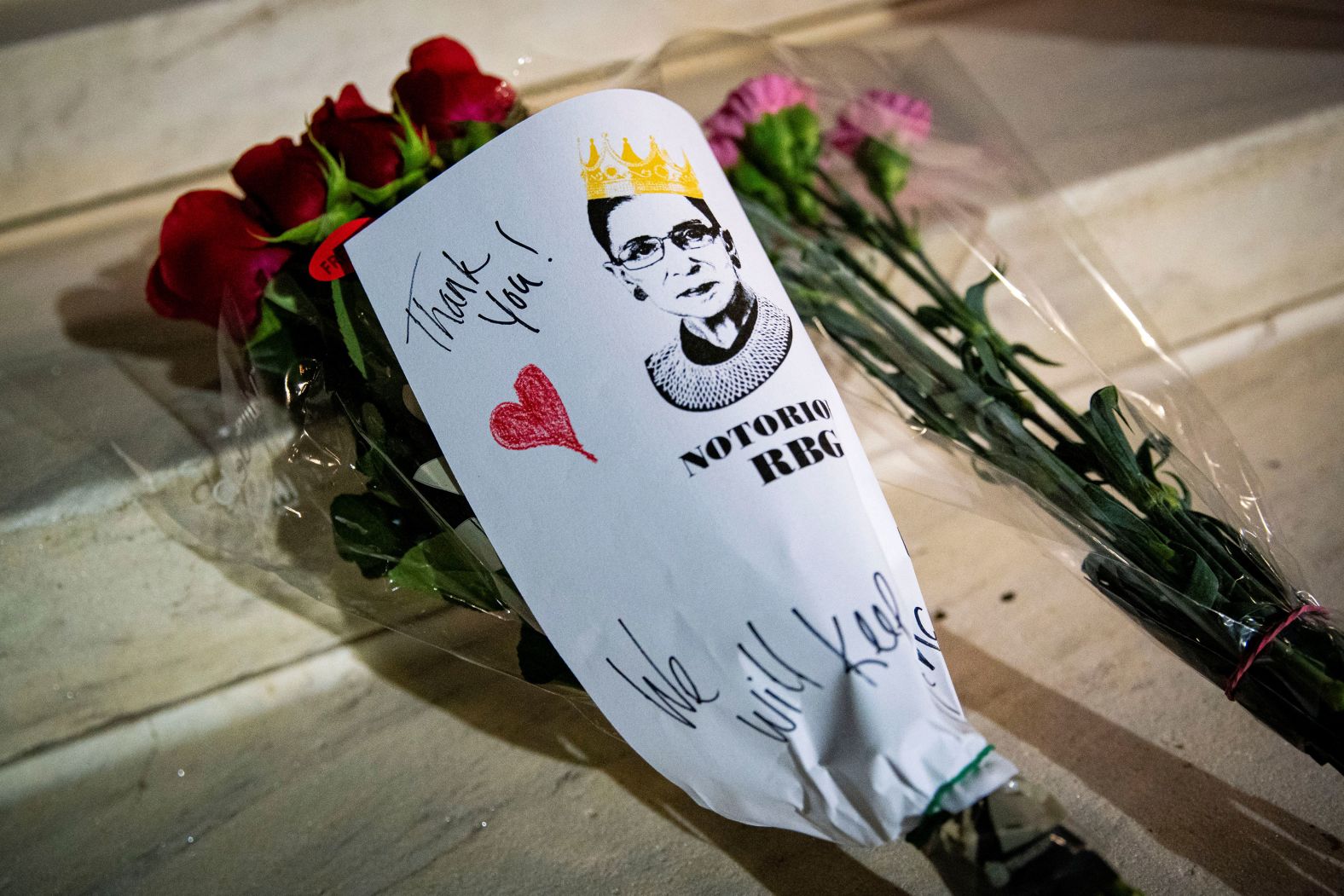 A bouquet of flowers is left for Ginsburg on the Supreme Court steps.