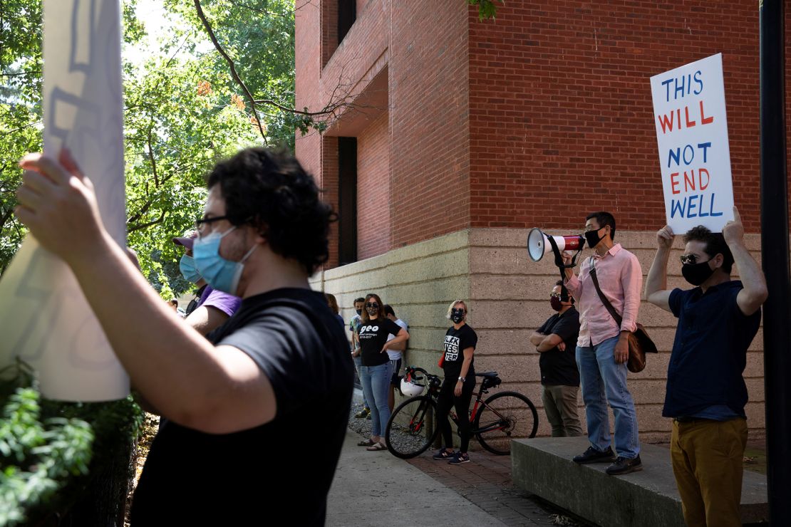 Students and faculty protest in-person class for fall semester amid the coronavirus  pandemic outside of the house of University of Michigan President Mark Schlissel at the University of Michigan.