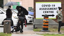 People line up to be tested for COVID-19 at a testing centre in Toronto on Sunday, Sept. 13, 2020. (Nathan Denette/The Canadian Press via AP)