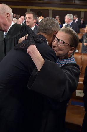President Barack Obama hugs Ginsburg as he arrives to deliver the State of the Union address in January 2015. Ginsburg didn't shy away from fashion. <a href="index.php?page=&url=https%3A%2F%2Fwww.cnn.com%2F2018%2F03%2F21%2Fpolitics%2Fruth-bader-ginsburg-scrunchies%2Findex.html" target="_blank">She often accessorized</a> her black robe with intricate lace collars and an array of different gloves.