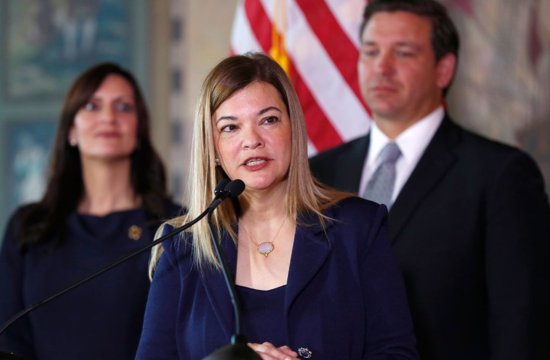 Barbara Lagoa, center, Governor Ron DeSantis' pick for the Florida Supreme Court, speaks after being introduced, as DeSantis and Lt. Gov Jeanette Nunez, left, look on Jan. 9, 2019, in Miami. (AP Photo/Wilfredo Lee)