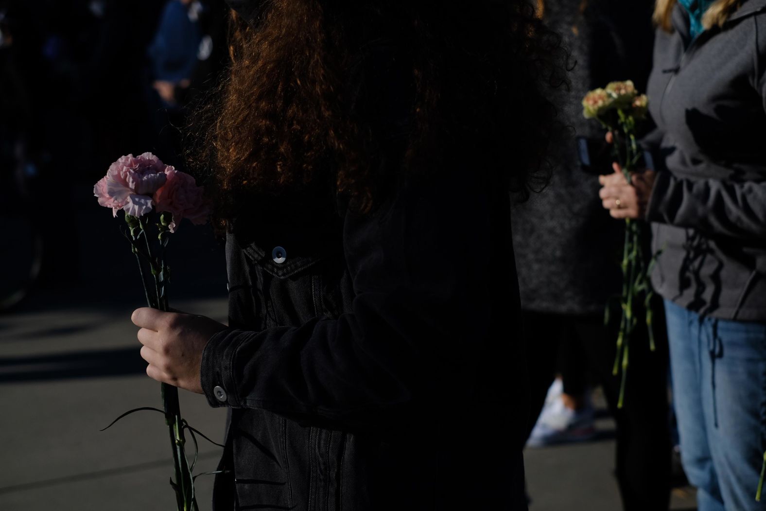 People bring flowers to the Supreme Court on September 19.