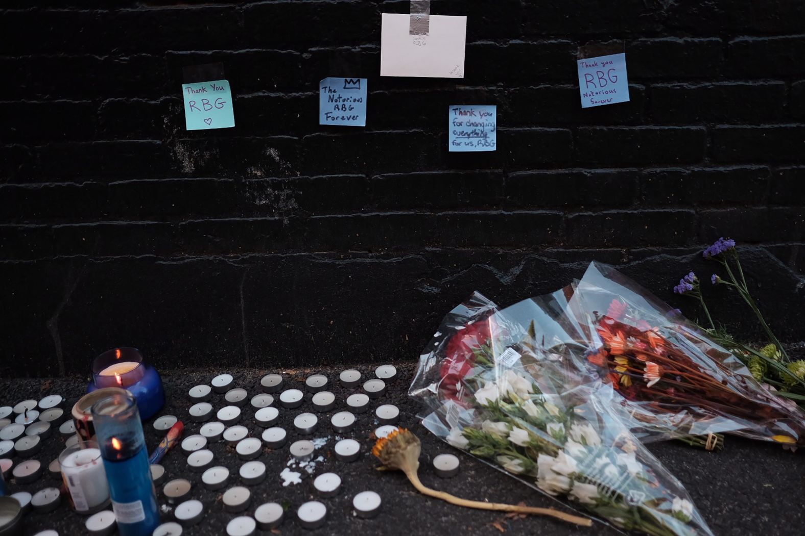 Mourners created a memorial underneath the Ginsburg mural.