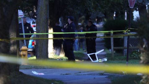 Rochester police examine the scene of Saturday's shooting.
