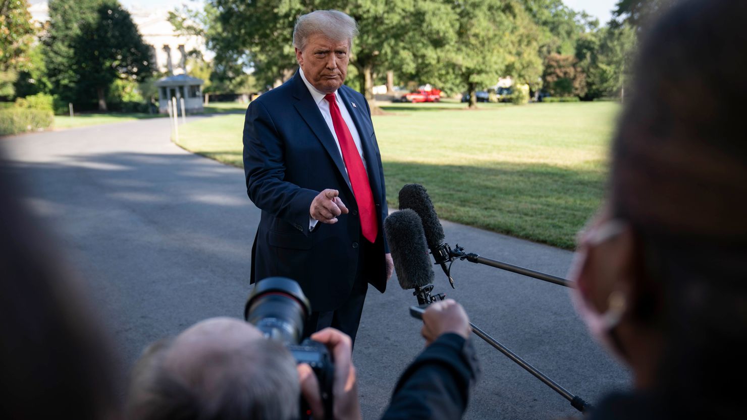 Trump speaks to the press before his departure from the White House on Saturday for a North Carolina campaign rally. (Photo by Sarah Silbiger/Getty Images)