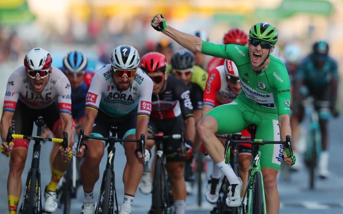Team Deceuninck rider Ireland's Sam Bennett takes the final stage of the 107th edition of the Tour de France on the Champs Elysees to confirm his green jersey classification victory.