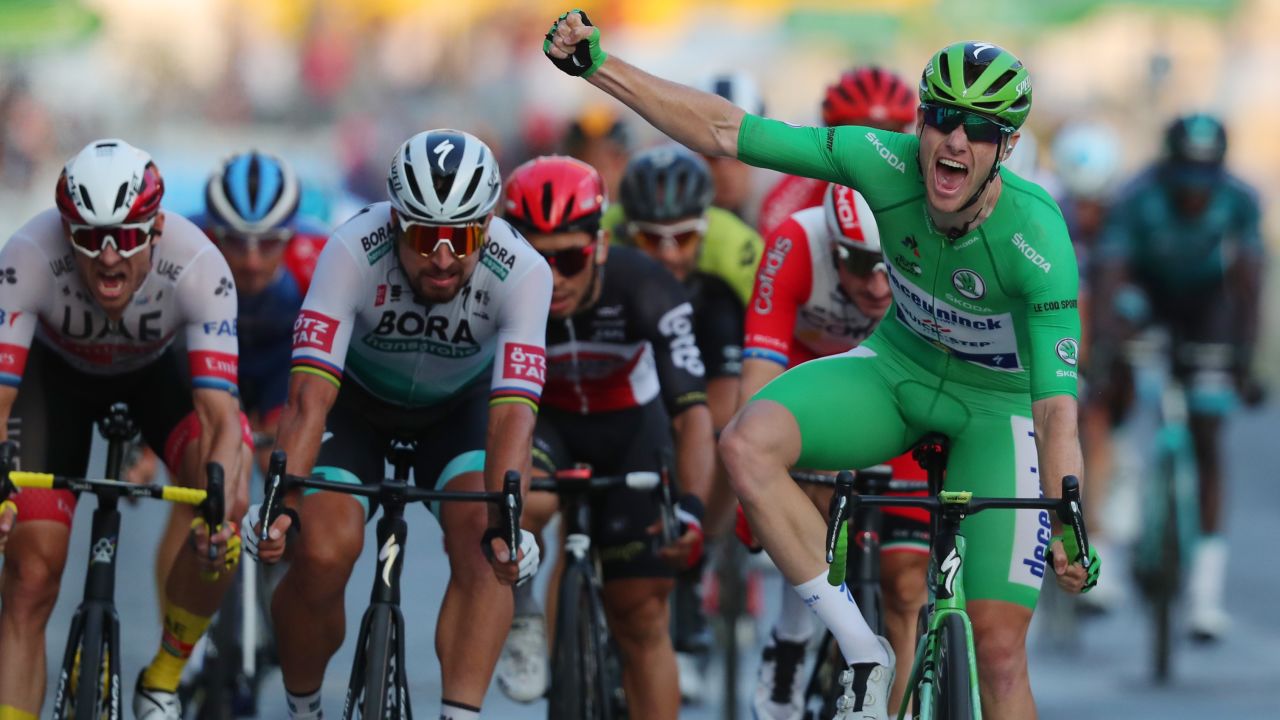 Team Deceuninck rider Ireland's Sam Bennett takes the final stage of the 107th edition of the Tour de France on the Champs Elysees to confirm his green jersey classification victory.