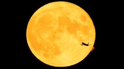 MINNEAPOLIS, MN - AUG. 3: An aircraft that took off from MSP and transited across the full moon, which in August is known as the Sturgeon Moon, Monday night in Minneapolis. (Photo by Jeff Wheeler/Star Tribune via Getty Images)