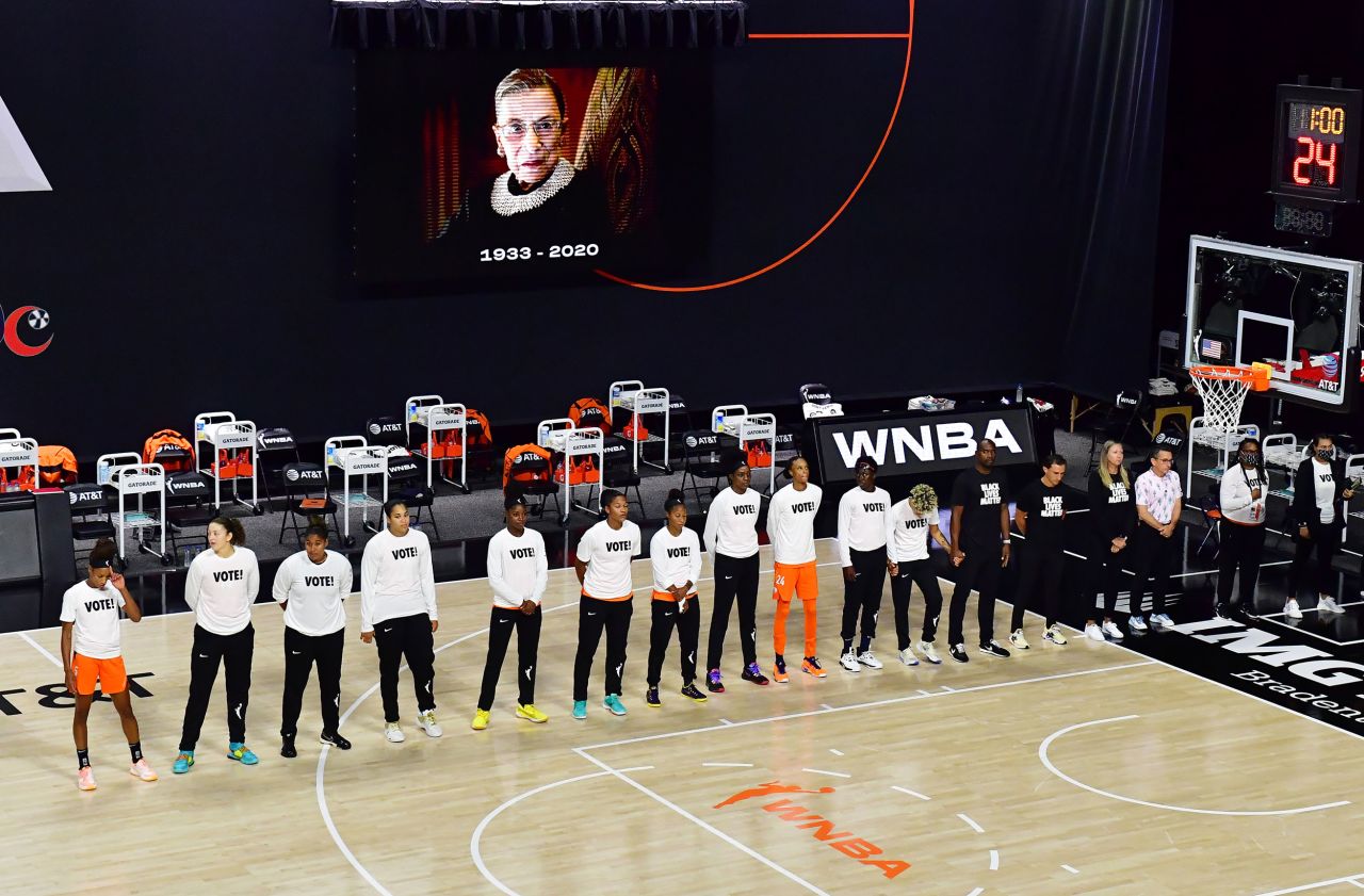 The WNBA's Connecticut Sun wear T-shirts that say "Vote" while observing a moment of silence for Ginsburg before their playoff game on September 20.
