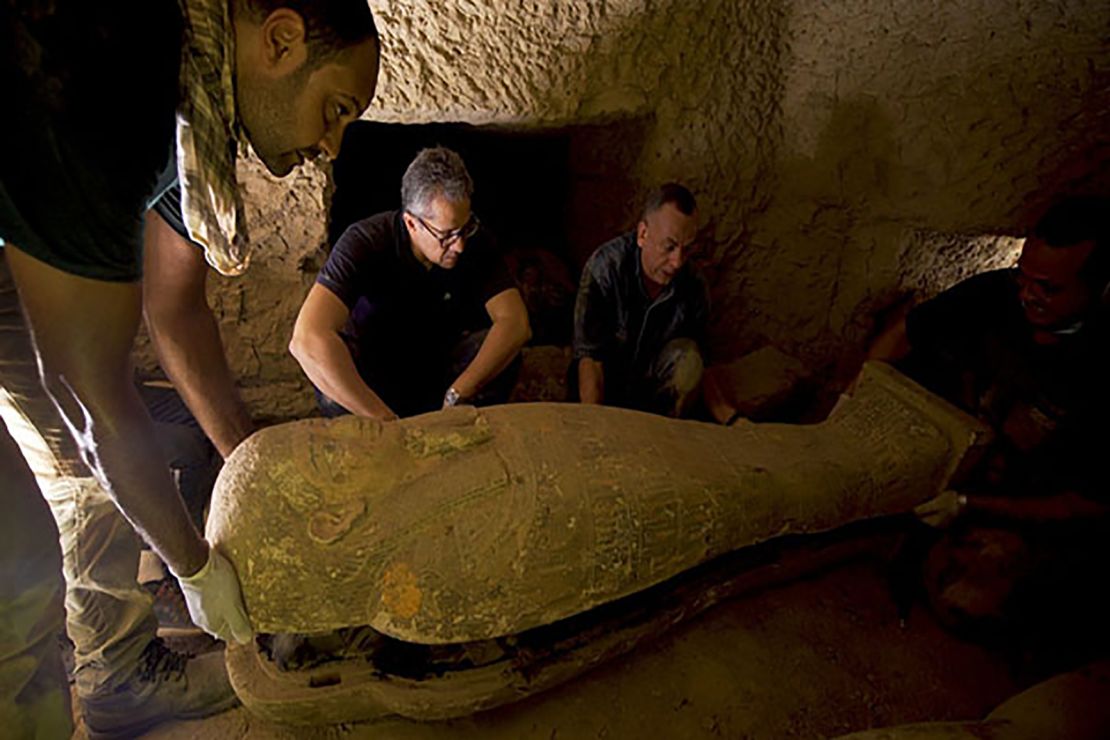 Tourism and Antiquities Minister Khaled El-Enany and Mustafa Waziri, the secretary general of the Supreme Council of Antiquities, inspect one of the sarcophagi. 