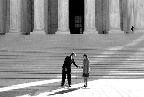 From the steps of the Supreme Court, Rehnquist introduces Ginsburg to the press in October 1993.