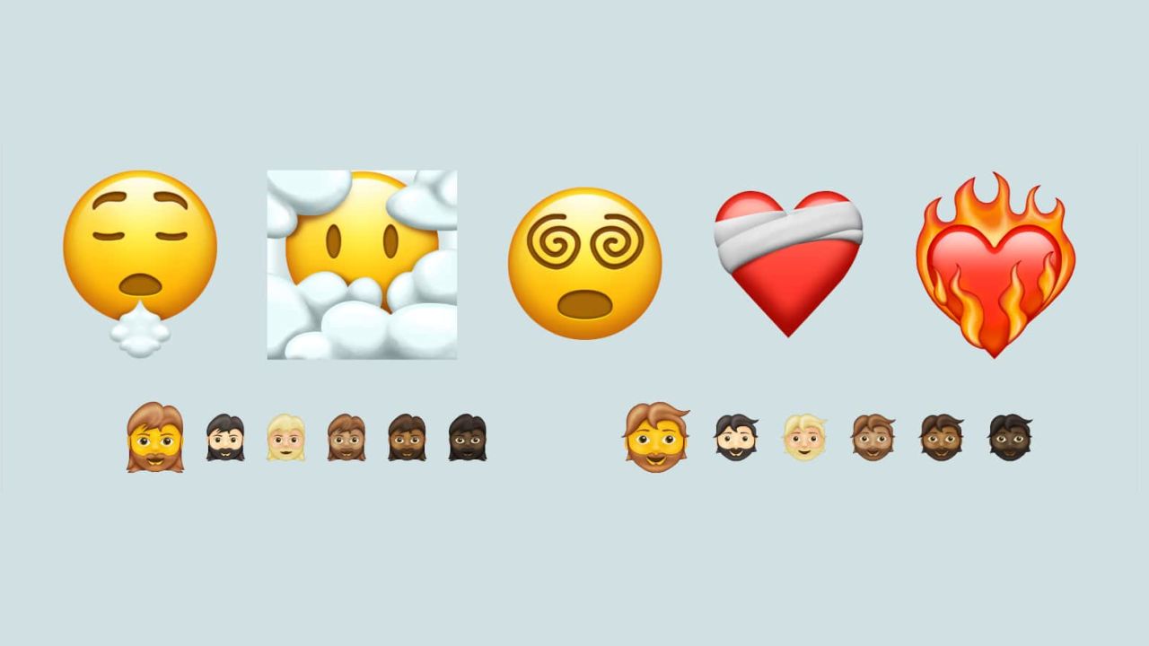 A sample of the new emojis coming in 2021 shows the bandaged heart, face in the clouds and bearded faces.