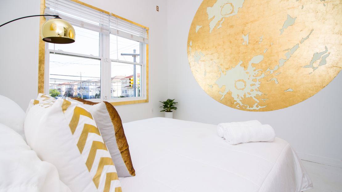 All of the rooms at The High Tide Hotel are designed by local artists. Jason Heuer, who, with his wife  owns the area's only bookstore, is responsible for this room's golden touch.