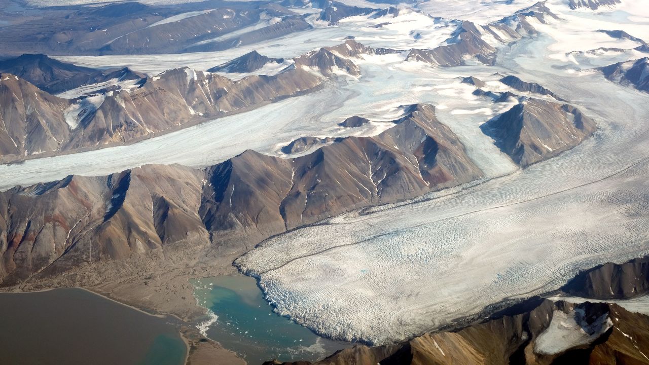 In this view from a passenger plane. melting glaciers are seen during a summer heat wave on Svalbard archipelago on July 28, 2020 near Longyearbyen, Norway. 