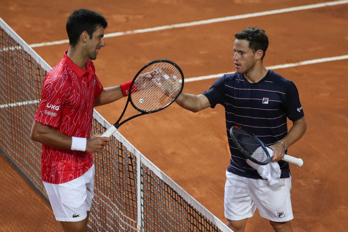 Djokovic (left) meets at the net with Schwartzman following the Italian Open final. 