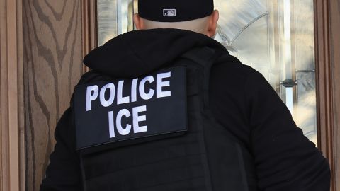 US Immigration and Customs Enforcement officers arrive to a home in search of an undocumented immigrant in April 2018 in New York City.