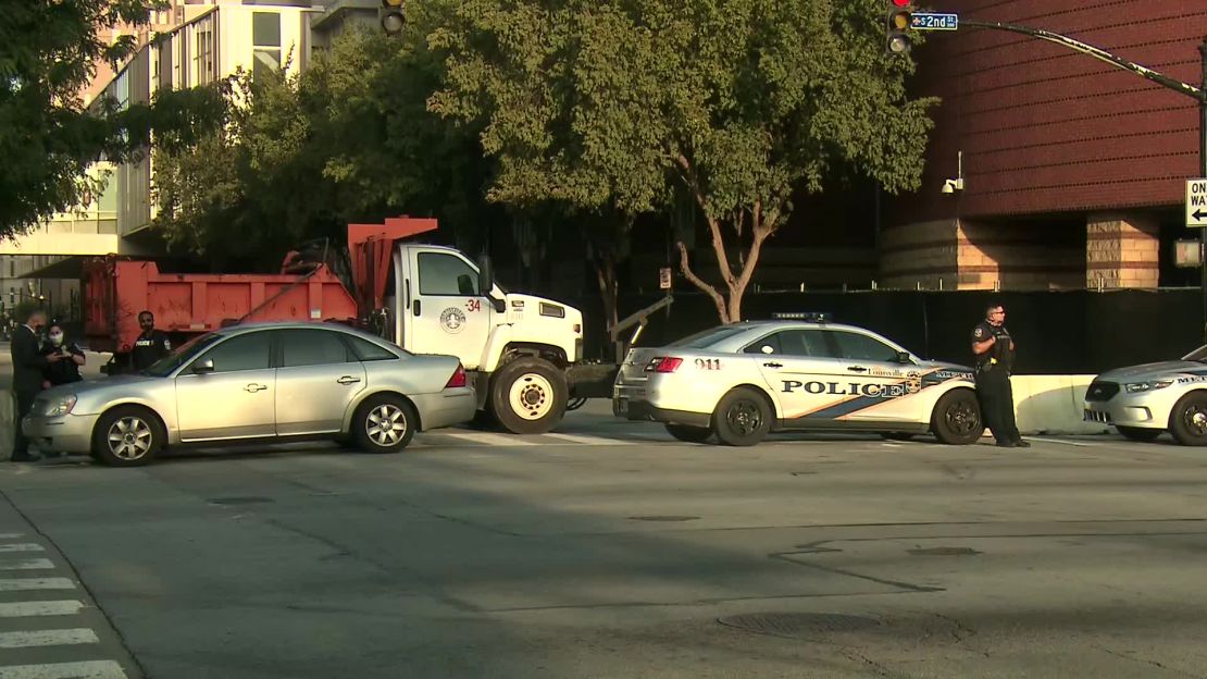 Police vehicles and a large truck restrict access to downtown Louisville, Kentucky, on Tuesday.