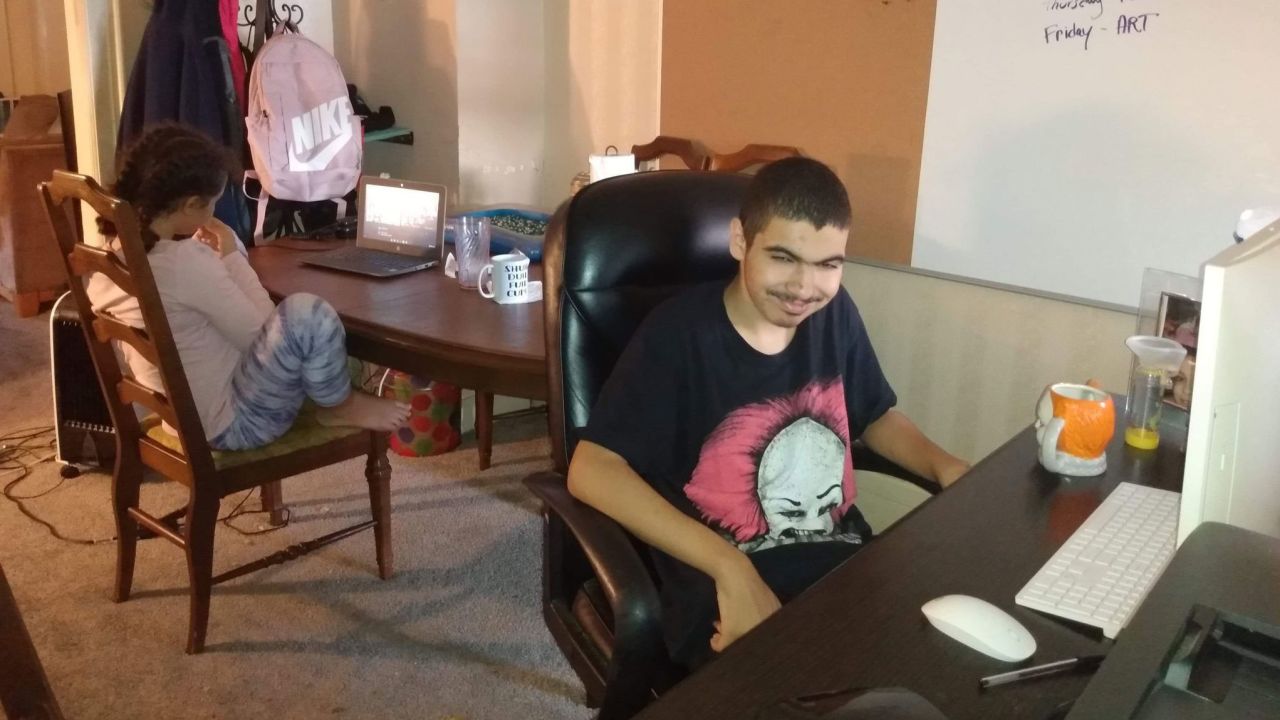 Before the pandemic, Jaydon Scott, who is severely autistic, would be assisted by a school aide. With online schooling from home in Philadelphia, his mother, Alicia Burgstahler, must fill that support role.