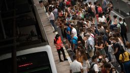 Students wait for a train to university during rush hour in Barcelona on September 17.