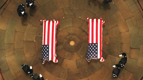 The caskets of Chestnut and detective John Gibson lie in honor