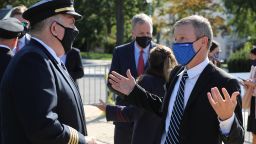 WASHINGTON, DC - SEPTEMBER 22: Wearing a face mask to reduce the risk posed by the coronavirus, United Airlines CEO Scott Kirby (R) talks with a pilot representative before a news conference to call on Congress to pass an extension of the Payroll Support Program to save thousands of travel jobs, outside the U.S. Capitol September 22, 2020 in Washington, DC. Set to expire on September 30, the PSP -- a mix of grants and loans worth about $50 billion -- gave a lifeline to the airline industry after the global coronavirus pandemic shut it down.  (Photo by Chip Somodevilla/Getty Images)