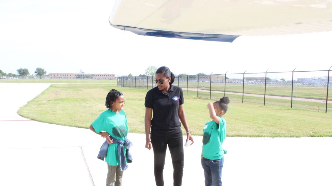 <strong>Next generation</strong>: Hughes says it's really important to communicate with kids: "They're amazed that I'm a pilot and I'm like, 'Yes, there are pilots out there that look like me and that look like you,'" she says.