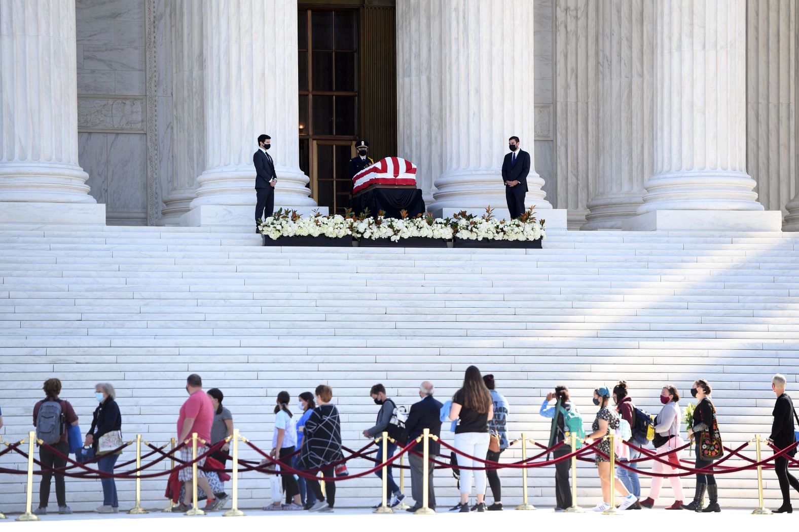 People pay their respects as Ginsburg lies in repose at the top of the Supreme Court steps.