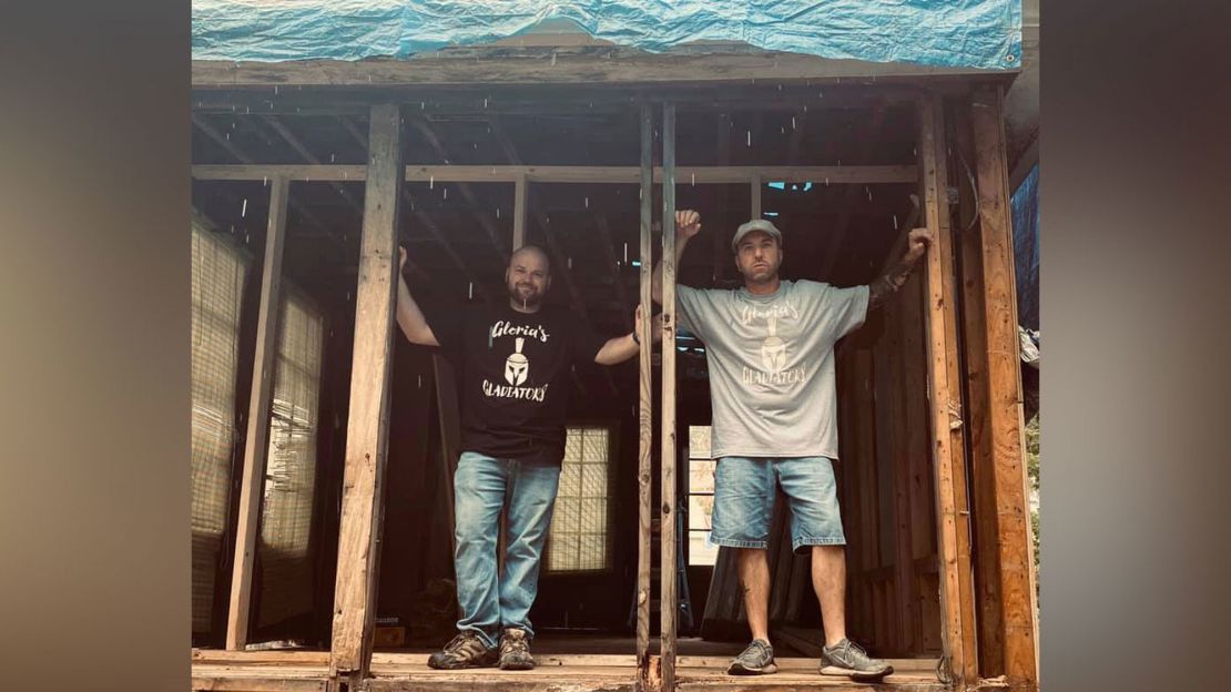 Electrician John Kinney, right, helped spark a movement to rebuild an elderly neighbor's home. 