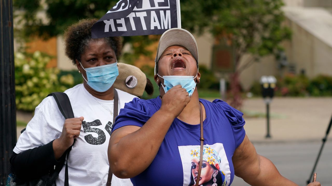 A woman reacts to news the grand jury's decision in the Breonna Taylor fatal shooting.