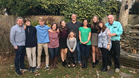 Ralph Gismondi and his wife, Ann, stand with their children and grandchildren.