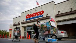 Shoppers wearing face masks leave a Costco wholesale store in Washington, D.C., the United States, Aug. 14, 2020. A new ensemble forecast published by the U.S. Centers for Disease Control and Prevention has projected up to 200,000 total COVID-19 deaths in the U.S. by Sept. 5. (Photo by Ting Shen/Xinhua/Getty Images)
