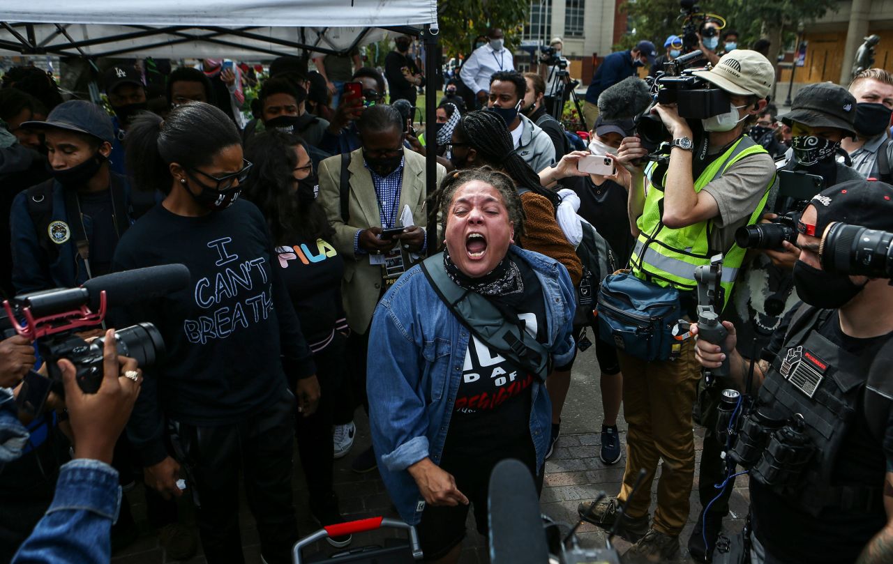 A Taylor supporter yells to journalists covering a protest in Louisville.
