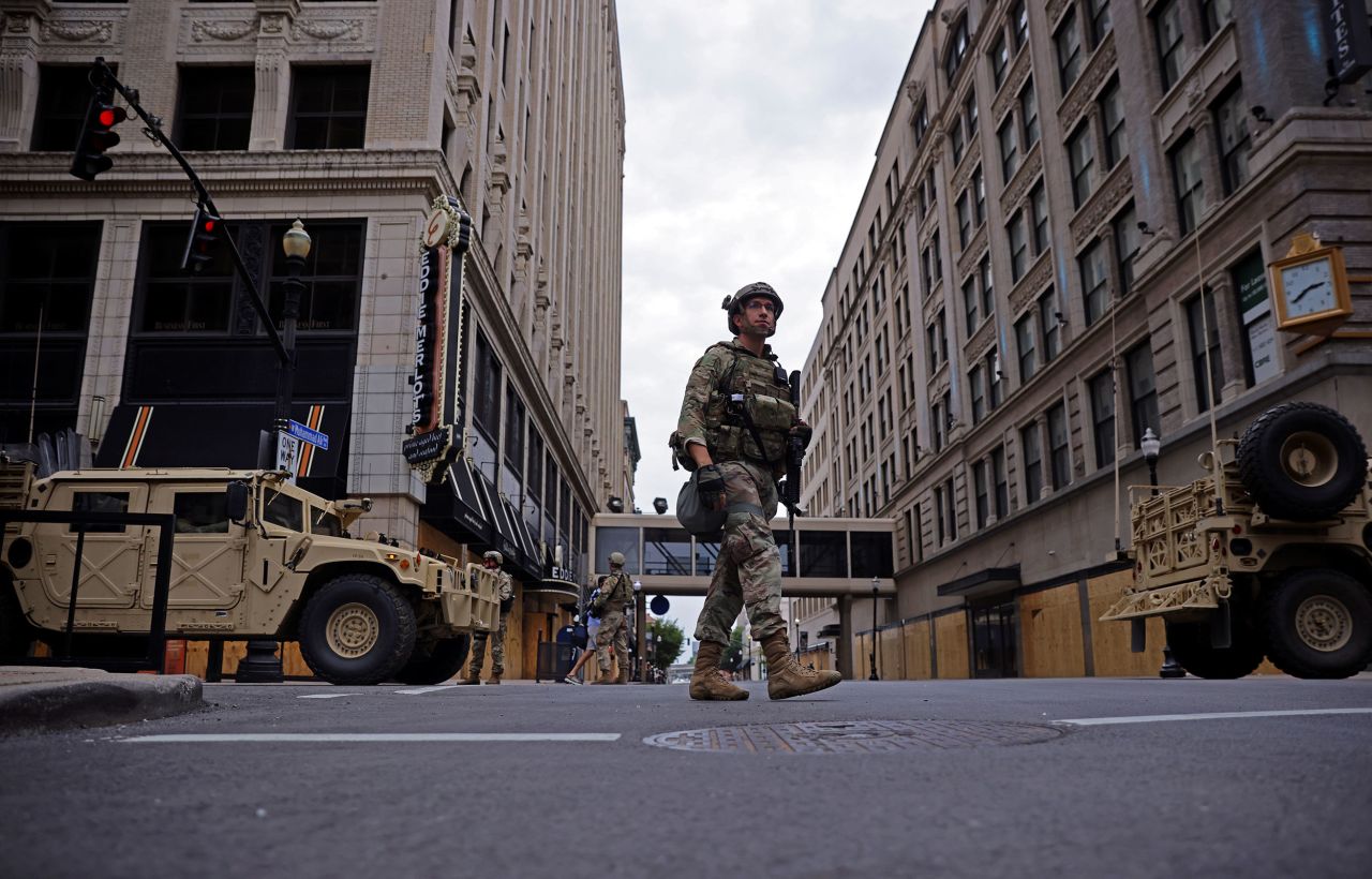 A member of the National Guard patrols downtown Louisville.
