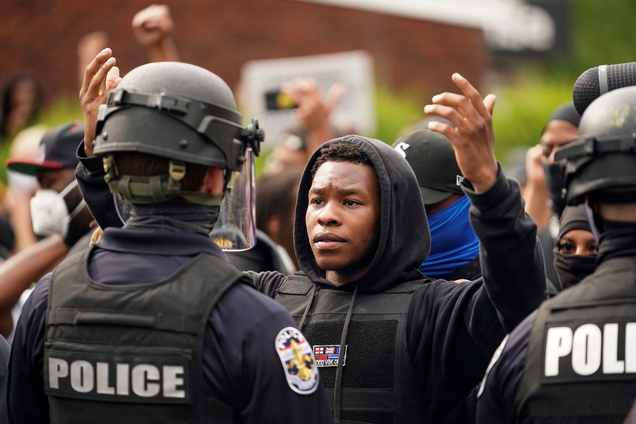 A demonstrator in Louisville confronts a police officer.