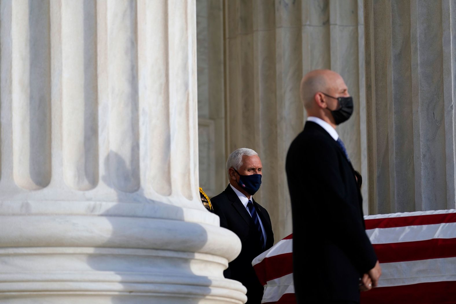 Vice President Mike Pence arrives at the top of the Supreme Court steps to pay his respects to Ginsburg. Pence was joined by his wife Karen. 
