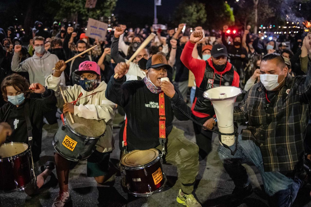 Protesters attend a march at the Lake Merritt Amphitheater in Oakland, California, in solidarity with Louisville protesters.